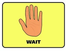Yellow visual cue card showing an open hand and the word "Wait"